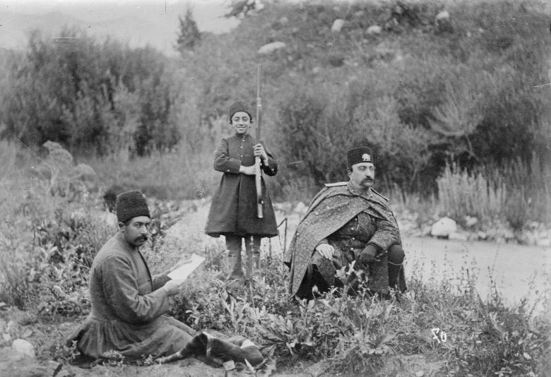 Antoin Sevruguin, Etemad al-Saltaneh Reading Books for Naser al-Din Shah, 1880s. — © In: Wikipedia.