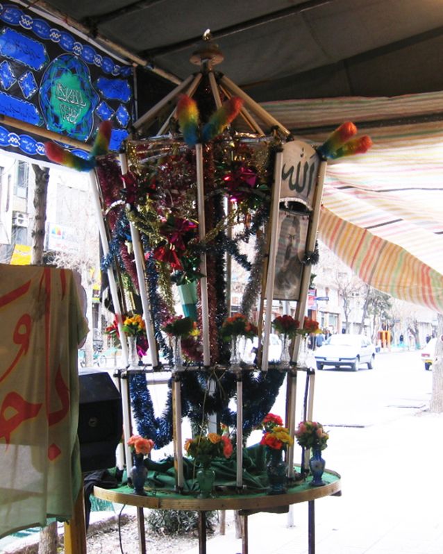 A tabaq or hejleh installed during the Ashura ceremonies, in honor of Imam Hussein who was martyred in the Battle of Karbala in 680 CE. Photograph by the author. — © Photograph by the author.