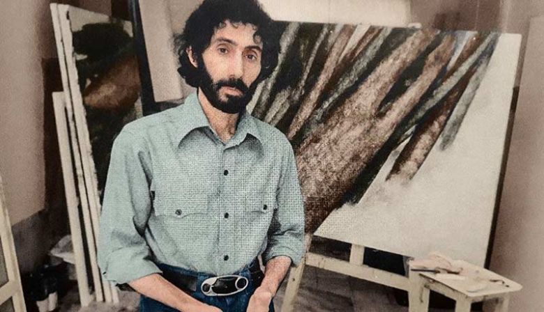 Sohrab Sepehri in front of a painting from the Trees series, mid-1970s. — © In: artmag.ir